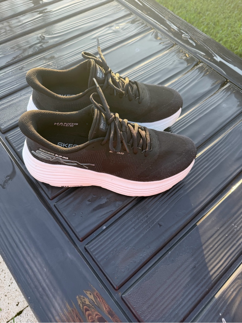 Skechers Womenβs Black Knit Slip-On Sneakers with White Platform
